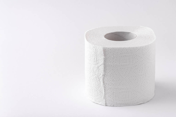 A roll of toilet paper on a white background. Copy space. Space for text. - Фото, зображення