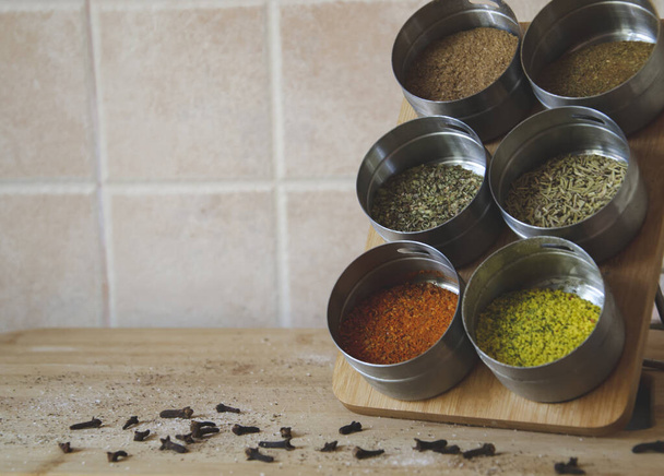 Set of various spices on kitchen background. Top view of mix bright spices and herbs in small bowls. Free copy space. Food and cuisine ingredients. Natural food spices and seasonings. Tasty eating.  - Photo, Image