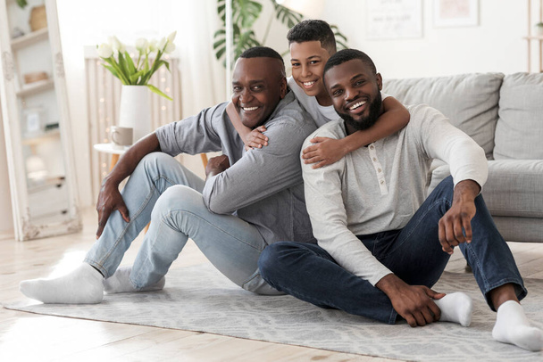 Male Generations. Portrait of preteen black boy hugging dad and grandfather - Photo, Image