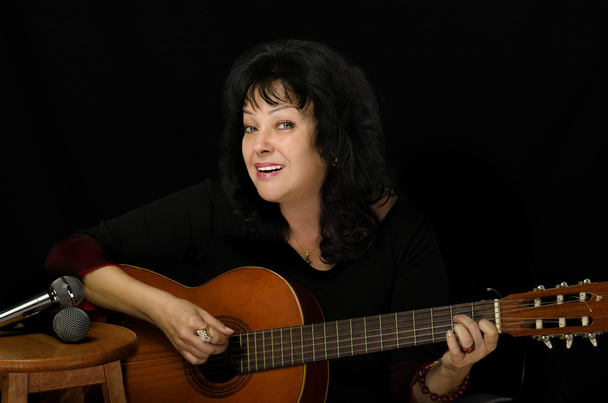 Actress sings and plays guitar - Foto, Imagem