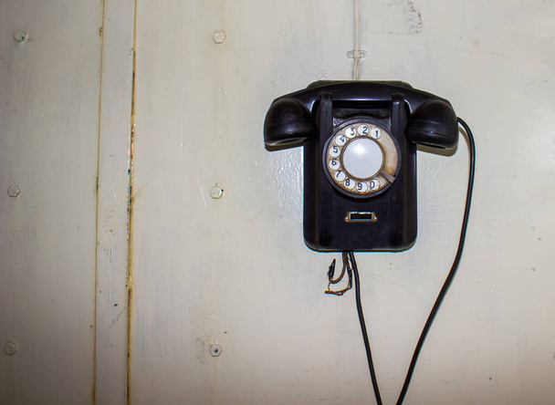 old black telephone, old fashioned telephone, old black fashioned telephone on white background - Photo, Image