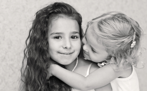 Two cute little sisters hugging - Photo, Image