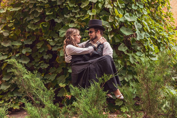 Beautiful girl with a guy, couple in love, in steampunk clothes close up - Fotografie, Obrázek