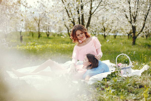 Cute and stylish family in a spring park - Foto, immagini