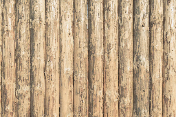Rustic wooden background of logs - a wooden fence - Fotoğraf, Görsel