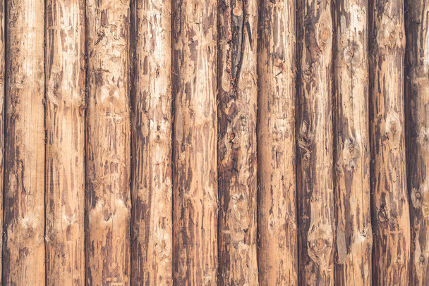 Rustic wooden background of logs - a wooden fence - Photo, Image