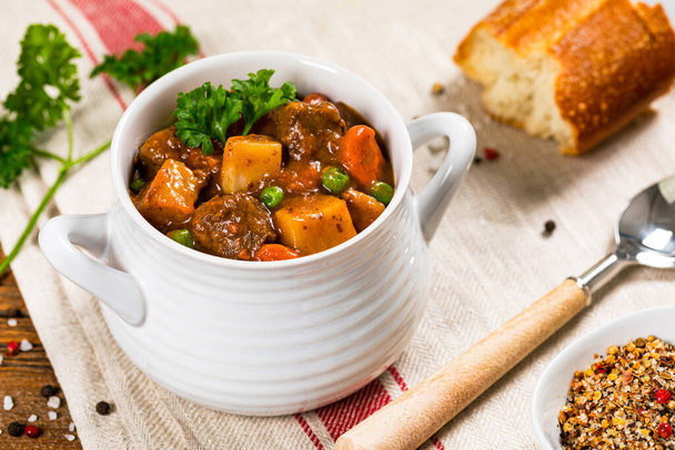 Beef Stew with Potatoes and Carrots on Wooden Background. Selective focus. - Photo, Image