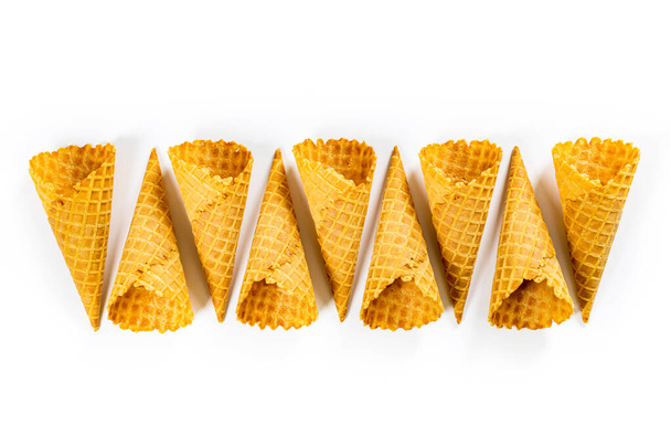 Empty Waffle Cone. Waffle Ice Cream Cones on White Background. Cone Shaped Pastry. Selective focus. - Photo, Image