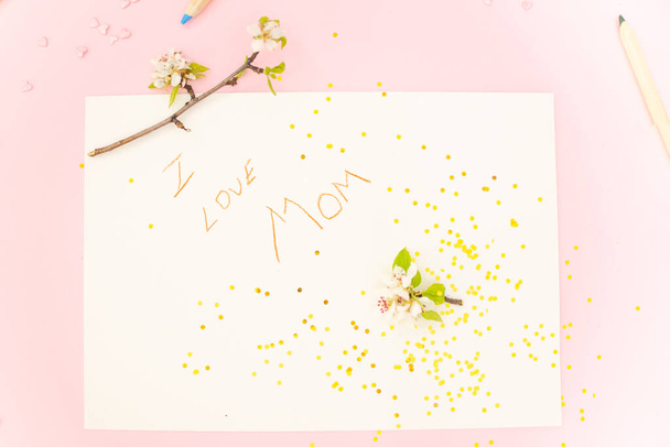 Childrens greeting card for mom with moms day on a pink background with confetti hearts and flowers. - Fotó, kép