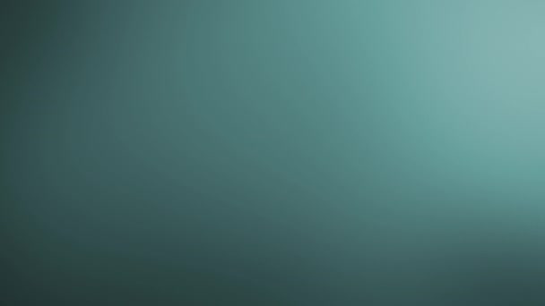 Abstraktes türkisfarbenes Licht mit elegantem Hintergrund. Geschlungener 4K-Bewegungs-Gradienten-Hintergrund mit nahtloser Schleife.  - Filmmaterial, Video