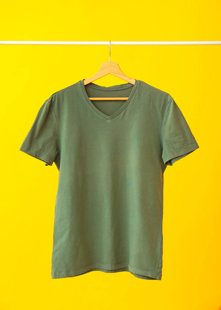 Stylish t-shirt on color background - Фото, зображення