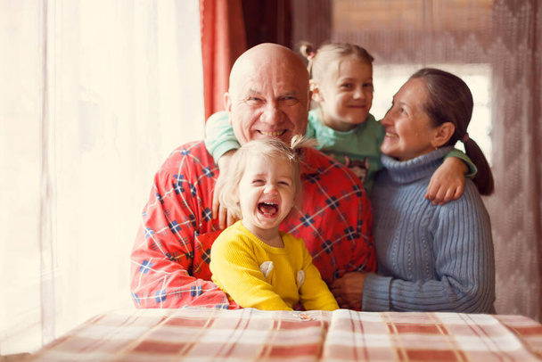Portrait of grandparents with their granddaughters  - Photo, Image