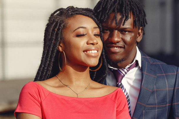 Stylish black couple spending time in a spring city - Foto, Imagen