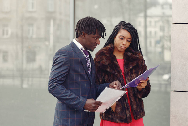 Stylish black couple have business conversation - Zdjęcie, obraz