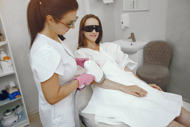 Woman in cosmetology studio on laser hair removal - Photo, Image