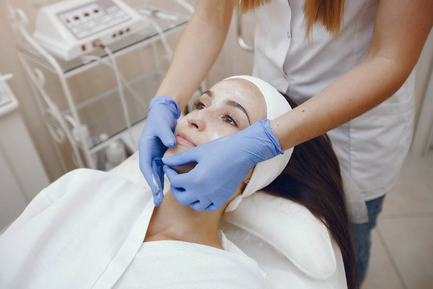 Woman in cosmetology studio on a procedures - Foto, Bild