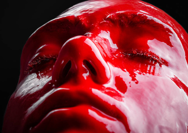 Image of girls face with red glossy paint - Φωτογραφία, εικόνα