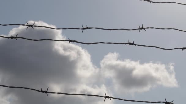Clouds passing with barbed wire fence - Footage, Video