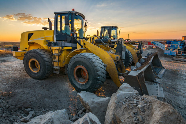 Group of excavators in a rock and stone quarry - Photo, Image
