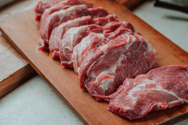 Pork chops on a cutting board. Selective focus - Foto, immagini