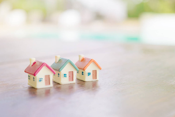 Miniature house on wooden background.Image for property real est - Photo, Image
