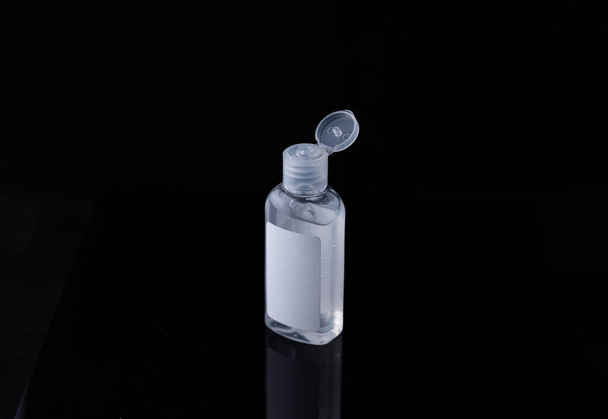 Bottle of antiseptic gel isolated on white, black background - Foto, imagen