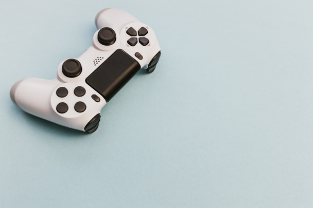 Video game playstation controller minimal white on blue color background - Foto, imagen