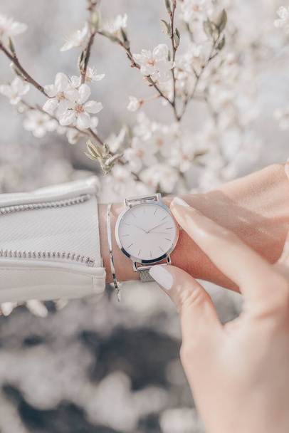 Stylish white watch on woman hand - Fotografie, Obrázek