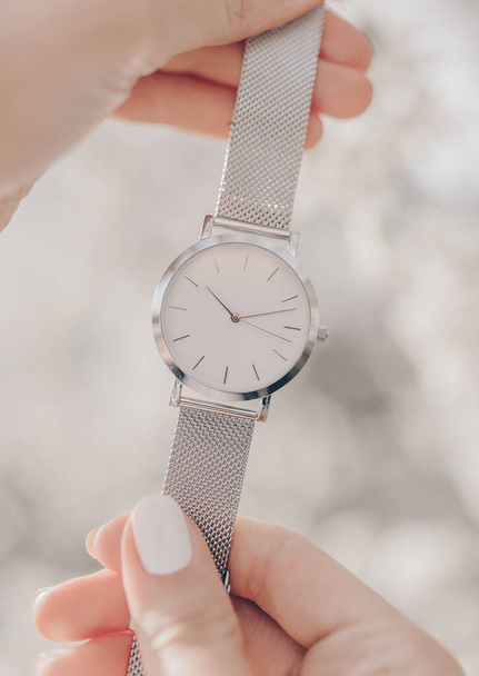 Stylish white watch in woman hands - Fotoğraf, Görsel