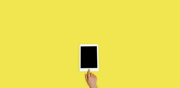 Hand using gadgets, device on top view, blank screen with copyspace, minimalistic style, flyer - Zdjęcie, obraz