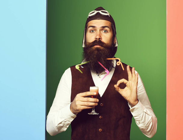 serious handsome bearded pilot on colorful studio background - Foto, Bild