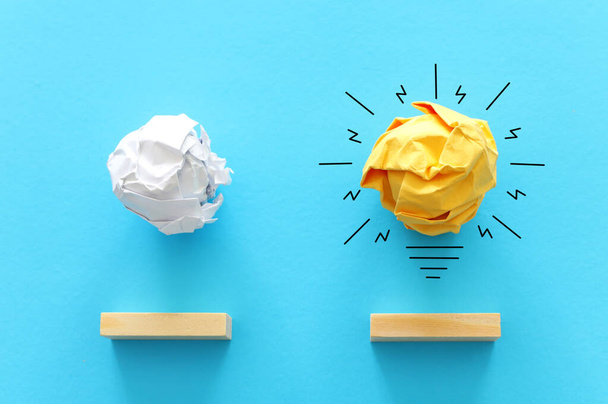 Education concept image. Creative idea and innovation. Crumpled paper as light bulb metaphor over blue background - Φωτογραφία, εικόνα