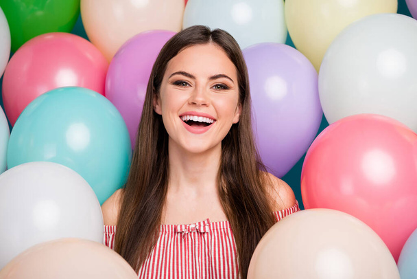 Close-up portrait of her she nice attractive lovely pretty charming cute cheerful cheery long-haired girl enjoying festal day good mood among colorful air balls - Foto, Imagem