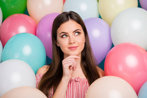 Close-up portrait of her she nice attractive lovely pretty charming cute dreamy curious long-haired girl touching chin thinking among colorful air balls creating gift idea - Fotografie, Obrázek