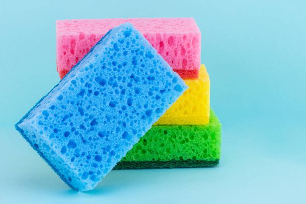 sponges for dishwashing on a blue background. - Photo, Image