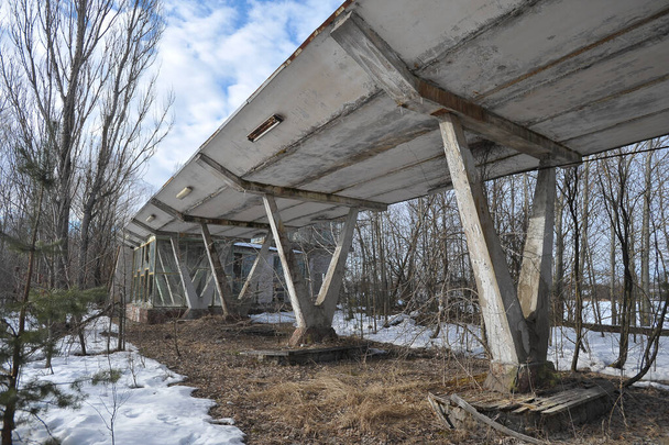 Architecture of abandoned river station in ghost town Pripyat, winter season in Chernobyl exclusion zone, Ukraine - Photo, Image