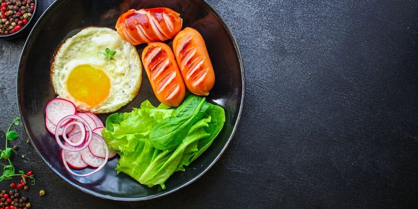 healthy breakfast, fried eggs sausages and vegetables Menu concept. food background. top view copy space for text keto or paleo diets - Photo, Image