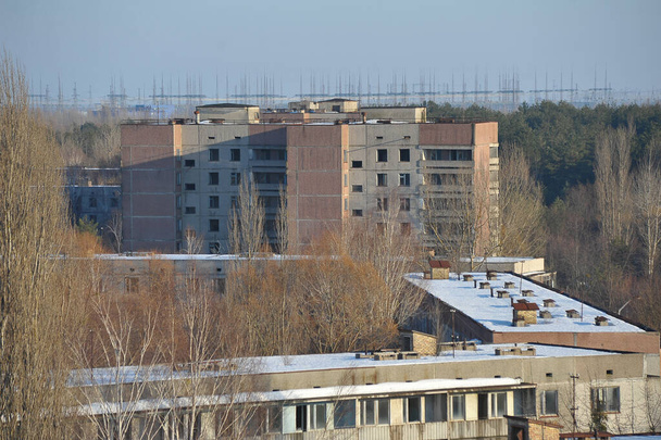 Hylätty aavekaupunki Pripyat, post apokalyptinen kaupunki, talvikausi Tsernobylin suojavyöhykkeellä, Ukraina
 - Valokuva, kuva