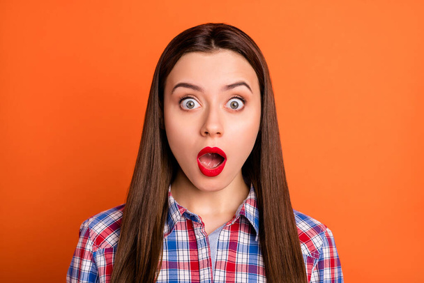 Closeup photo of attractive lady bright red pomade open mouth bad mood stupor not believe eyes epic fail wear casual plaid shirt isolated vibrant orange color background - Foto, Bild