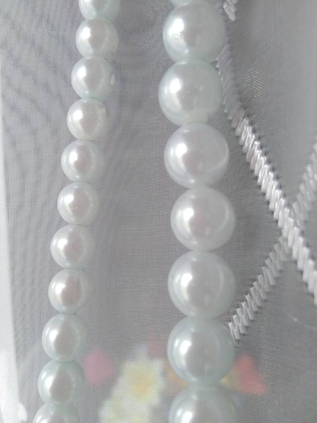 white pearls on a white background - Photo, Image