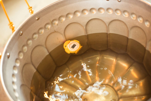 Baptismal font with thermometer - 写真・画像