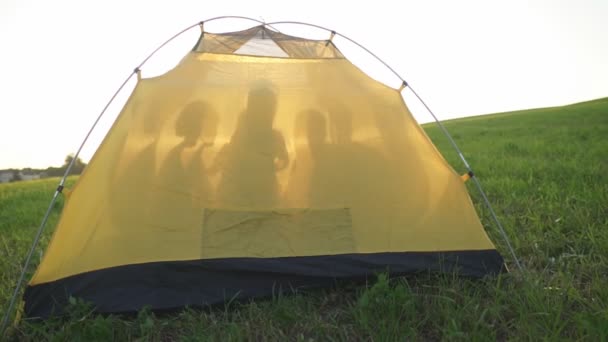 Yellow tent with person silhouette.  - Footage, Video