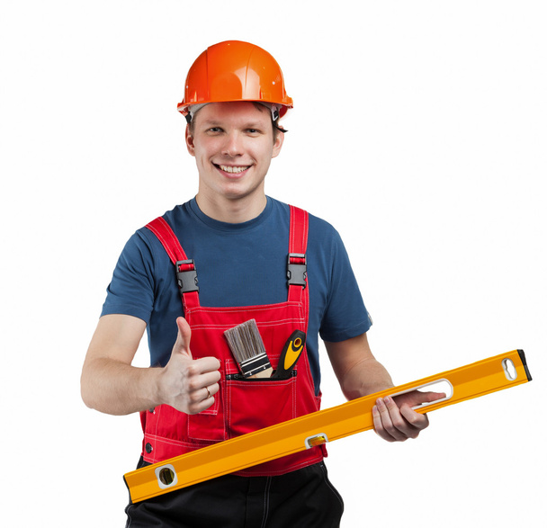 Cheerful construction worker in uniform - Фото, изображение