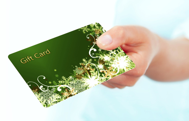 hand holding gift card isolated over white - Foto, Bild