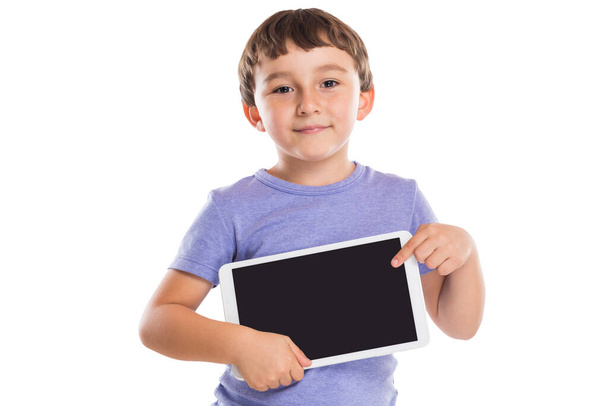 Young boy child pointing at tablet computer information marketing ad advertising isolated on a white background - Fotó, kép