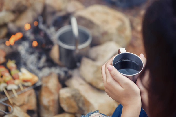 Sip coffee in a glass, grill and barbecue. Romantic atmosphere. Relaxing time camping on a mountain. Activity in holiday concept. - Foto, Imagen
