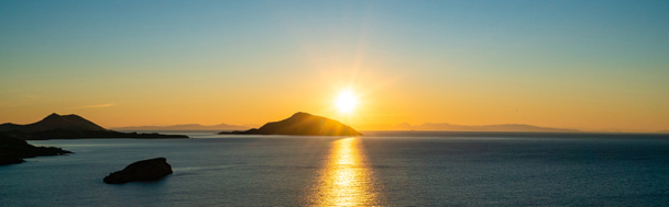 panoramic concept of sunset near scenic aegean sea in greece - Photo, Image