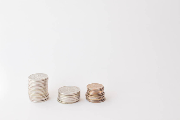  Three piles of coins on a white background. concept of money, finance, business. Berabota increase.copy space for text. - 写真・画像