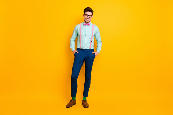 Full size photo of stunning classy content man enjoy summer free time holiday put hands pocket wear stylish bowtie shoes isolated over bright shine color background - 写真・画像
