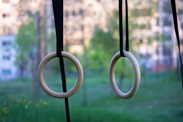 Gymnastics rings outside for a calisthenics workout during covid-19 - Photo, Image